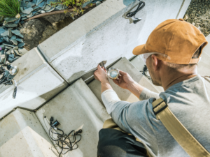 Technician fixing outdoor lighting