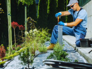 Lawn care specialist troubleshooting landscape lighting 