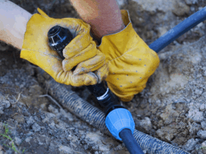 landscaper attempting to winterize sprinkler system